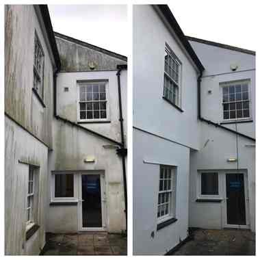 Rendered wall before and after softwash cleaning